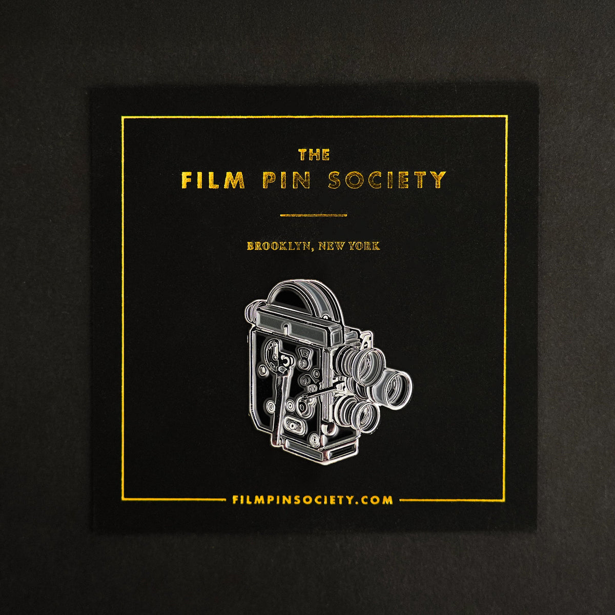 16mm Film Camera Enamel Pin on backing card