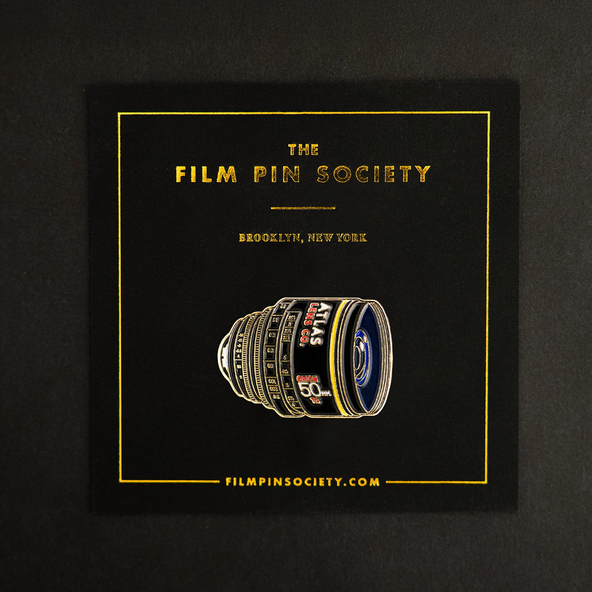 50mm Atlas Anamorphic Lens Enamel Pin on backing card