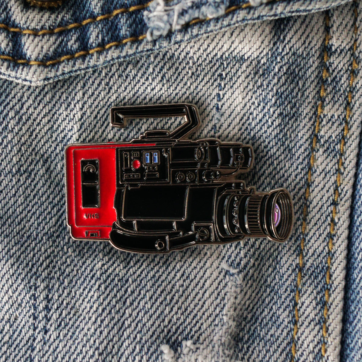80s VHS Camera Enamel Pin on a jacket