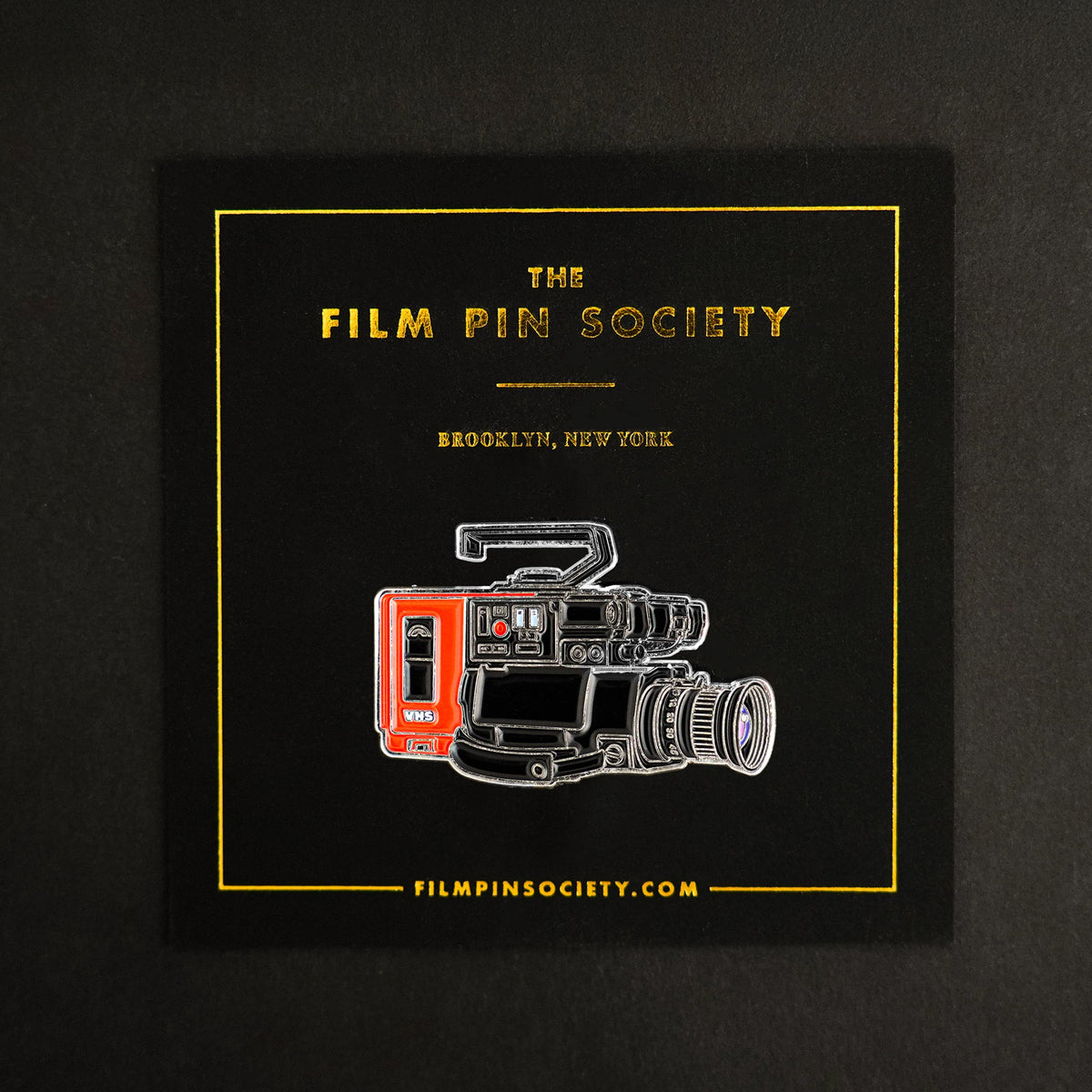 80s VHS Camera Enamel Pin on backing card