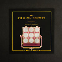 9 Light Enamel Pin on backing card