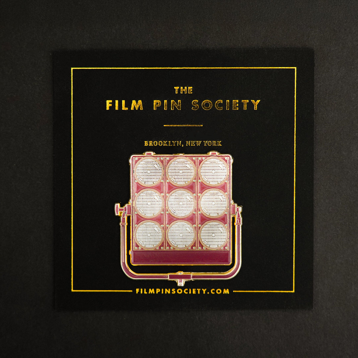 9 Light Enamel Pin on backing card