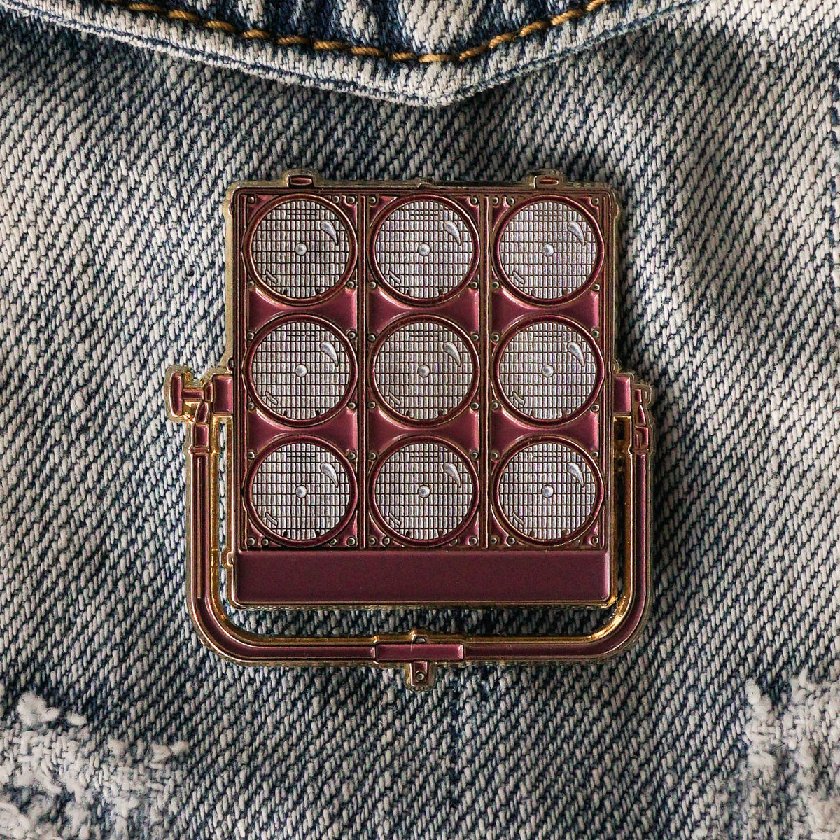 9 Light Enamel Pin on a jacket
