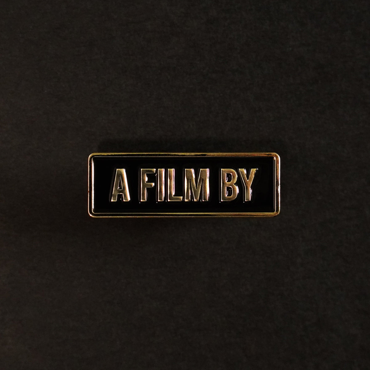 A Film By Credit Enamel Pin front