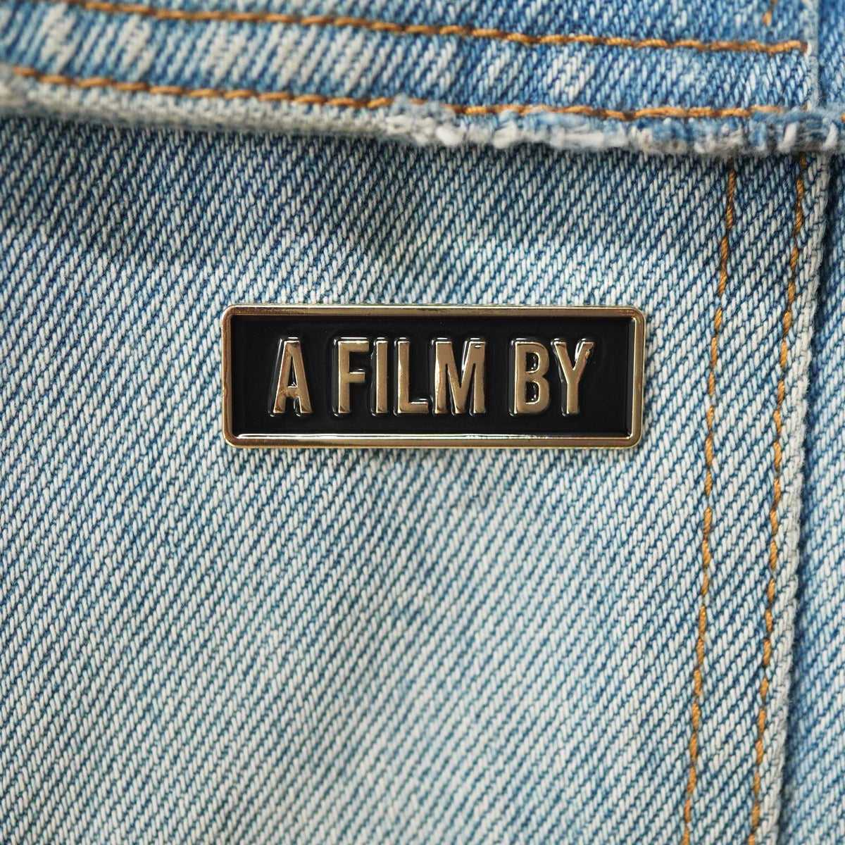 A Film By Credit Enamel Pin on a jacket
