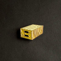 Apple Box Enamel Pin front