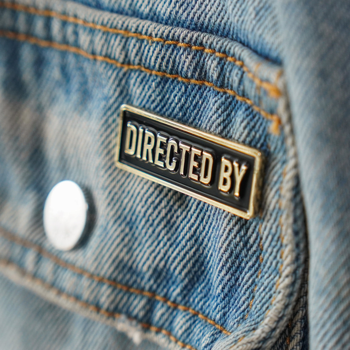 Directed By Credit Enamel Pin worn