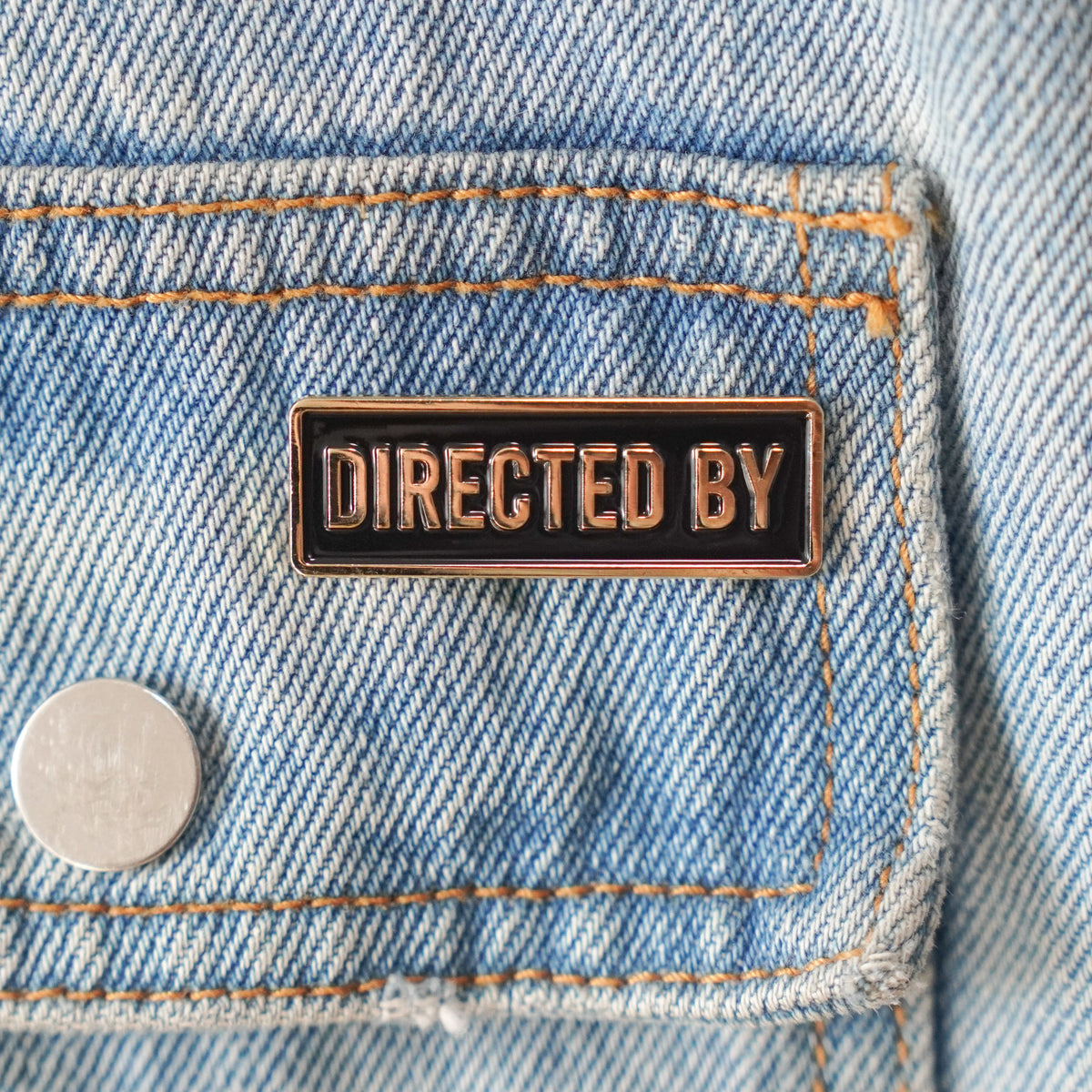 Directed By Credit Enamel Pin on a jacket