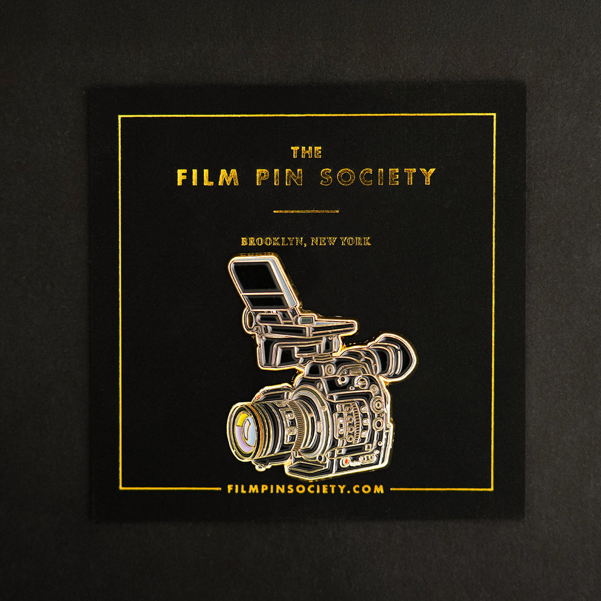 Doc Camera Enamel Pin on backing card