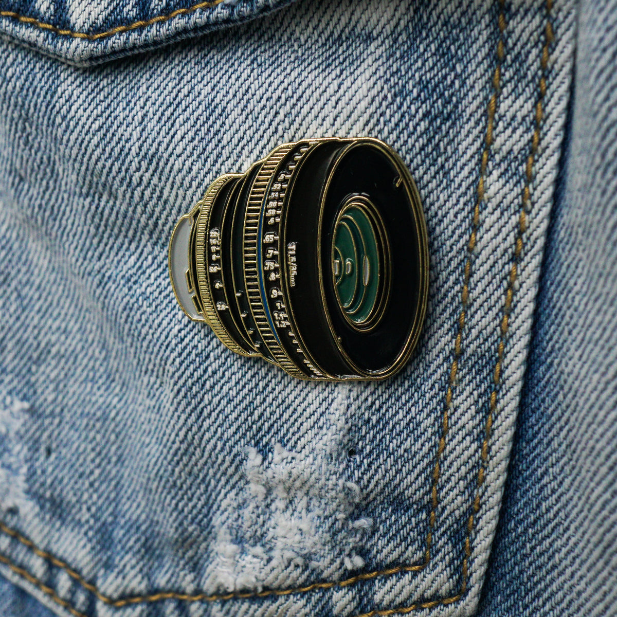 35mm Lens Enamel Pin worn