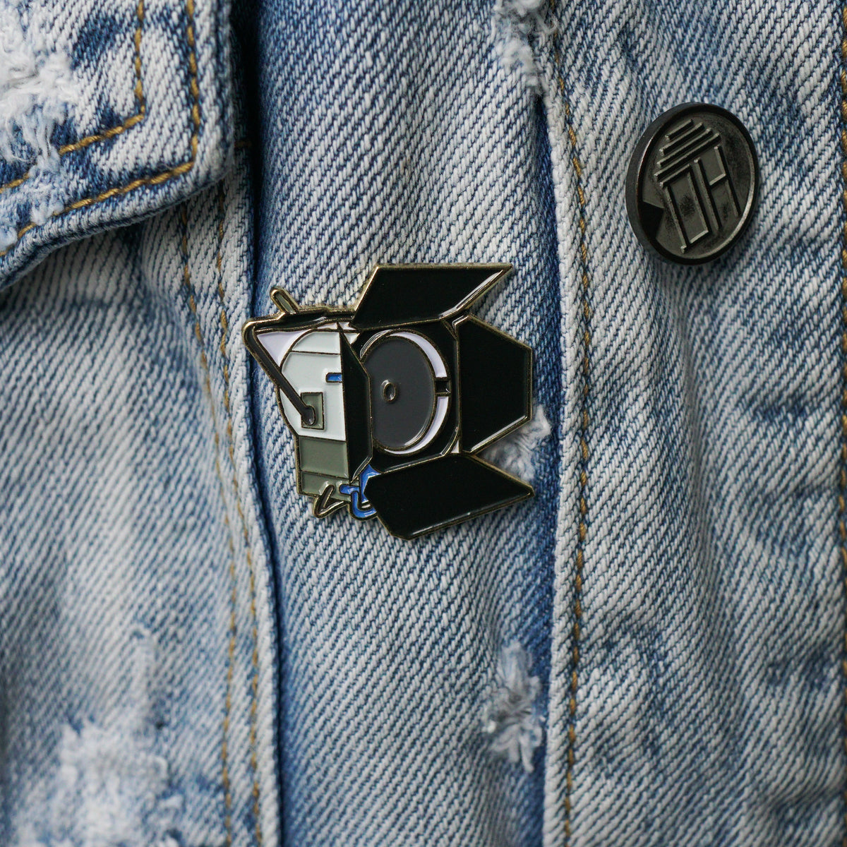 4K HMI Light Enamel Pin worn