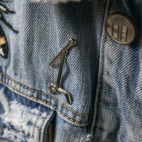 C-Stand Enamel Pin worn