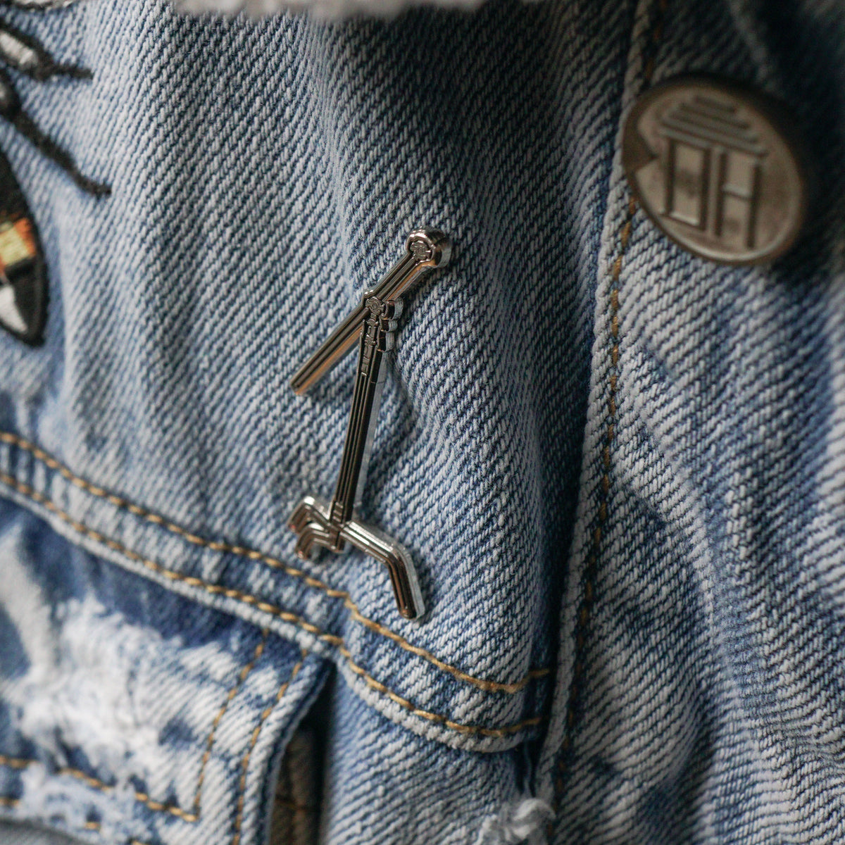 C-Stand Enamel Pin worn