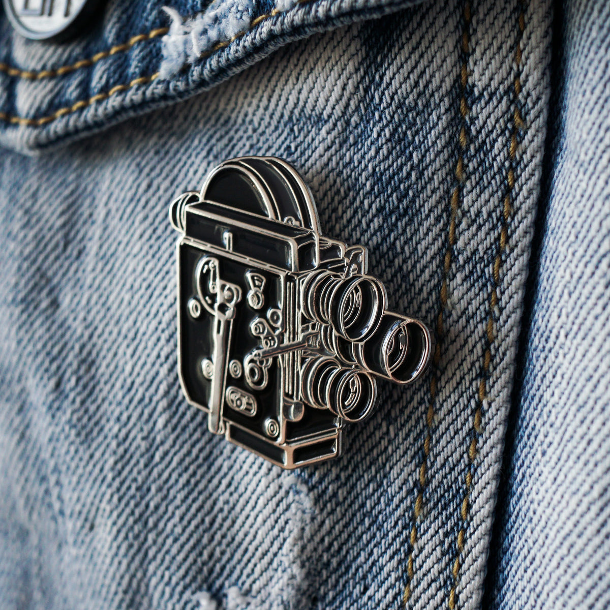 16mm Film Camera Enamel Pin worn
