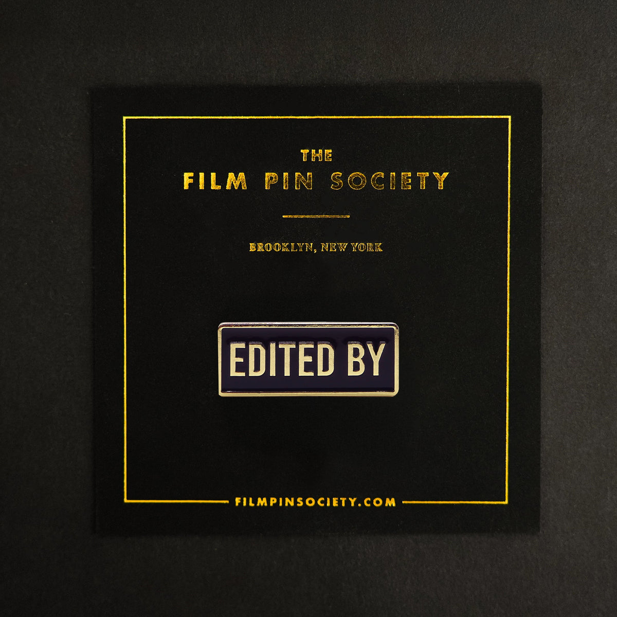 Edited By Credit Enamel Pin on backing card