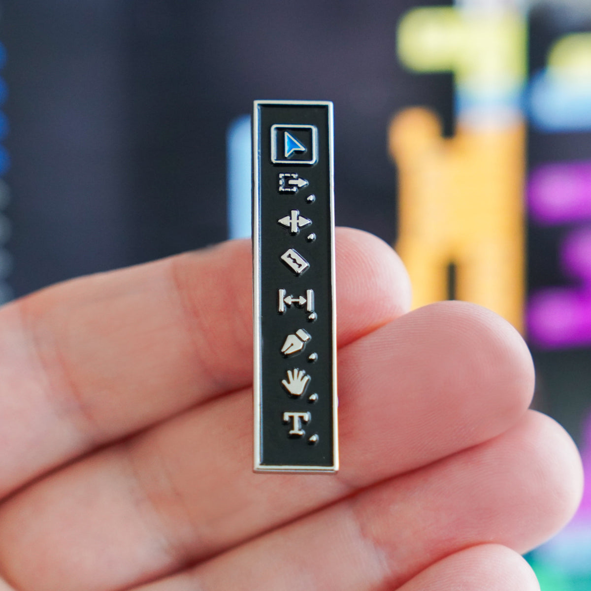 Editor's Toolbar Enamel Pin at an edit desk