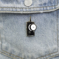 Follow Focus Enamel Pin on a jacket