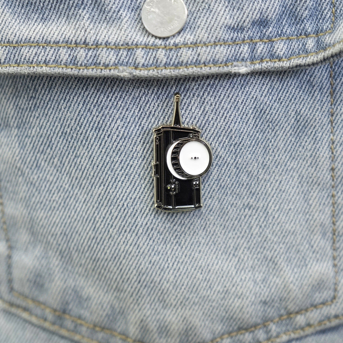 Follow Focus Enamel Pin on a jacket