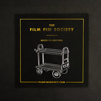 Film Cart Enamel Pin on backing card