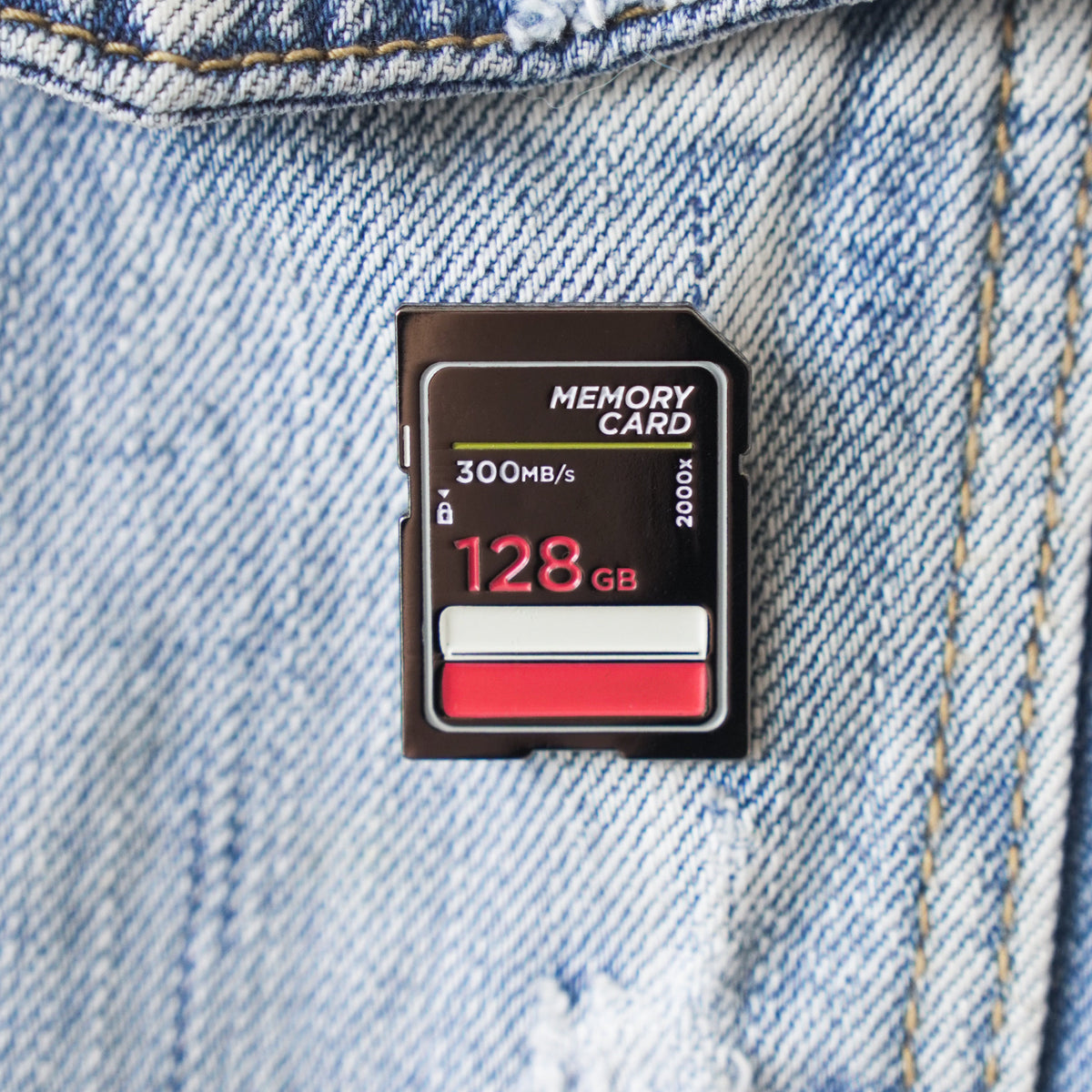 Memory Card Enamel Pin on a jacket