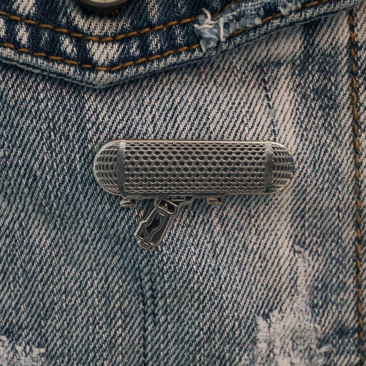 Microphone Enamel Pin on a jacket