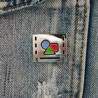 Pre-comp Enamel Pin on a jacket