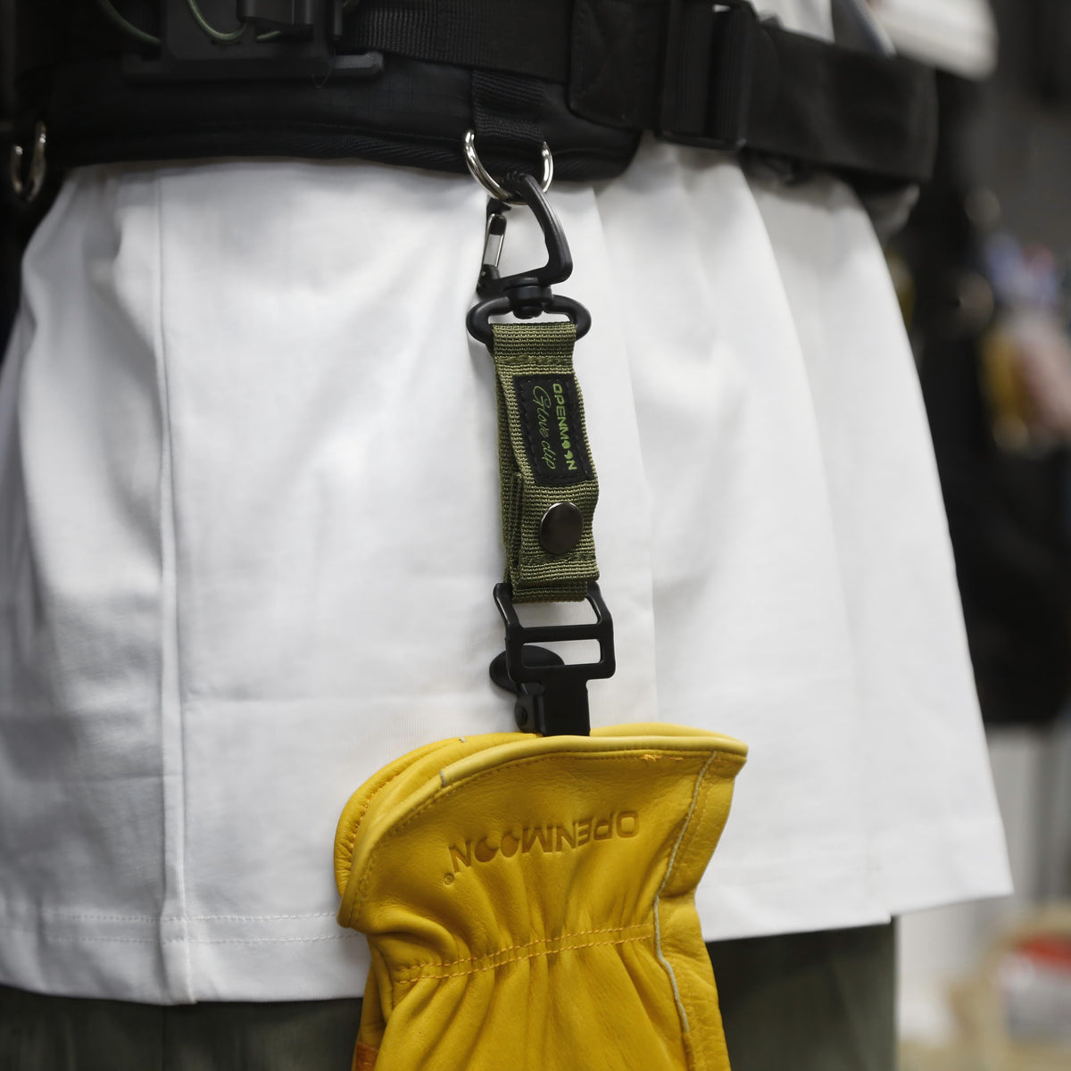 OpenMoon multi function glove clip in use on a belt