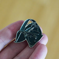 Sandbag Enamel Pin in hand