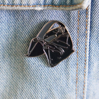 Sandbag Enamel Pin on a jacket