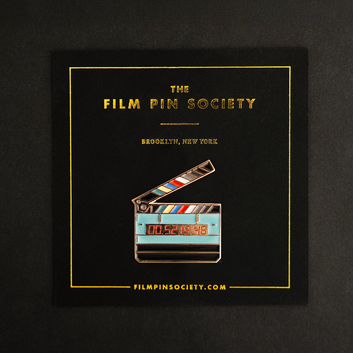Timecode Slate Enamel Pin on backing card