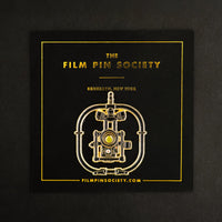 Camera Stabilizer Enamel Pin on backing card