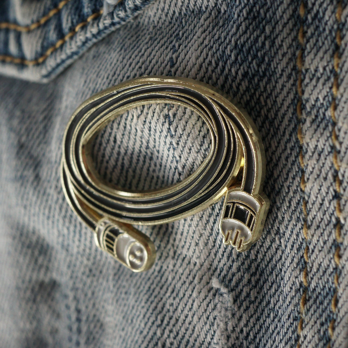 6ft Stinger Enamel Pin on a jacket