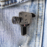 Super 8 Camera Enamel Pin on a jacket