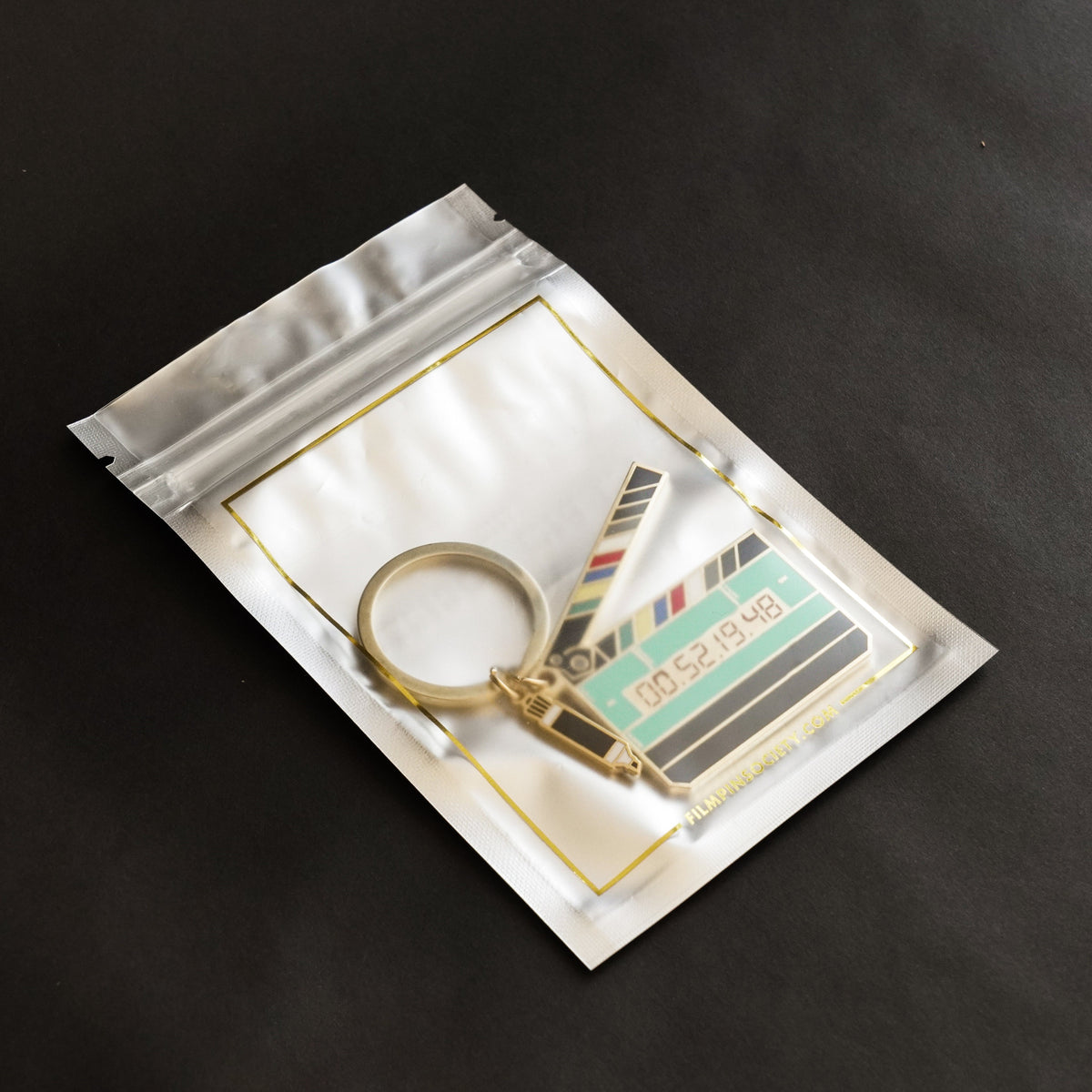 Timecode Slate Keychain on a bag