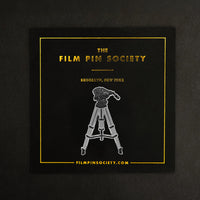 Tripod Enamel Pin on backing card
