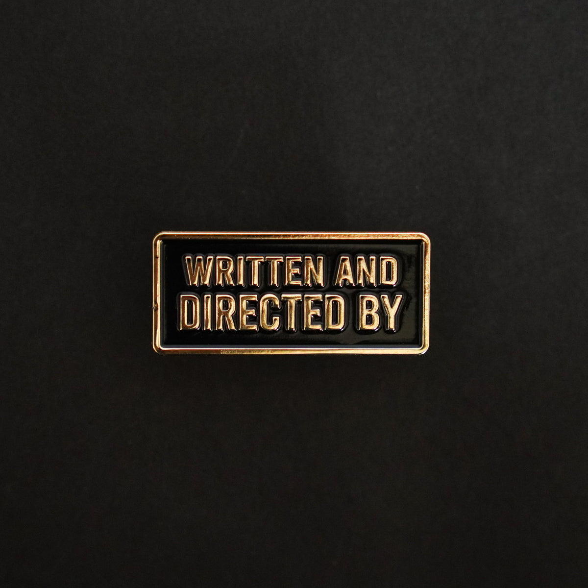 Written and Directed By Credit Enamel Pin front