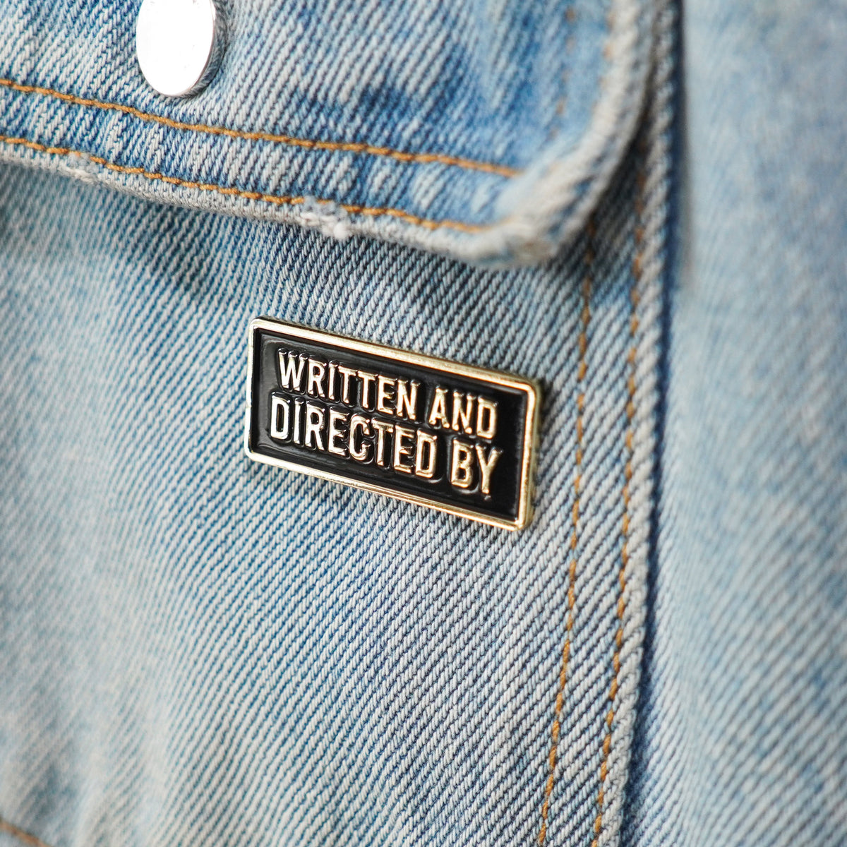 Written and Directed By Credit Enamel Pin worn
