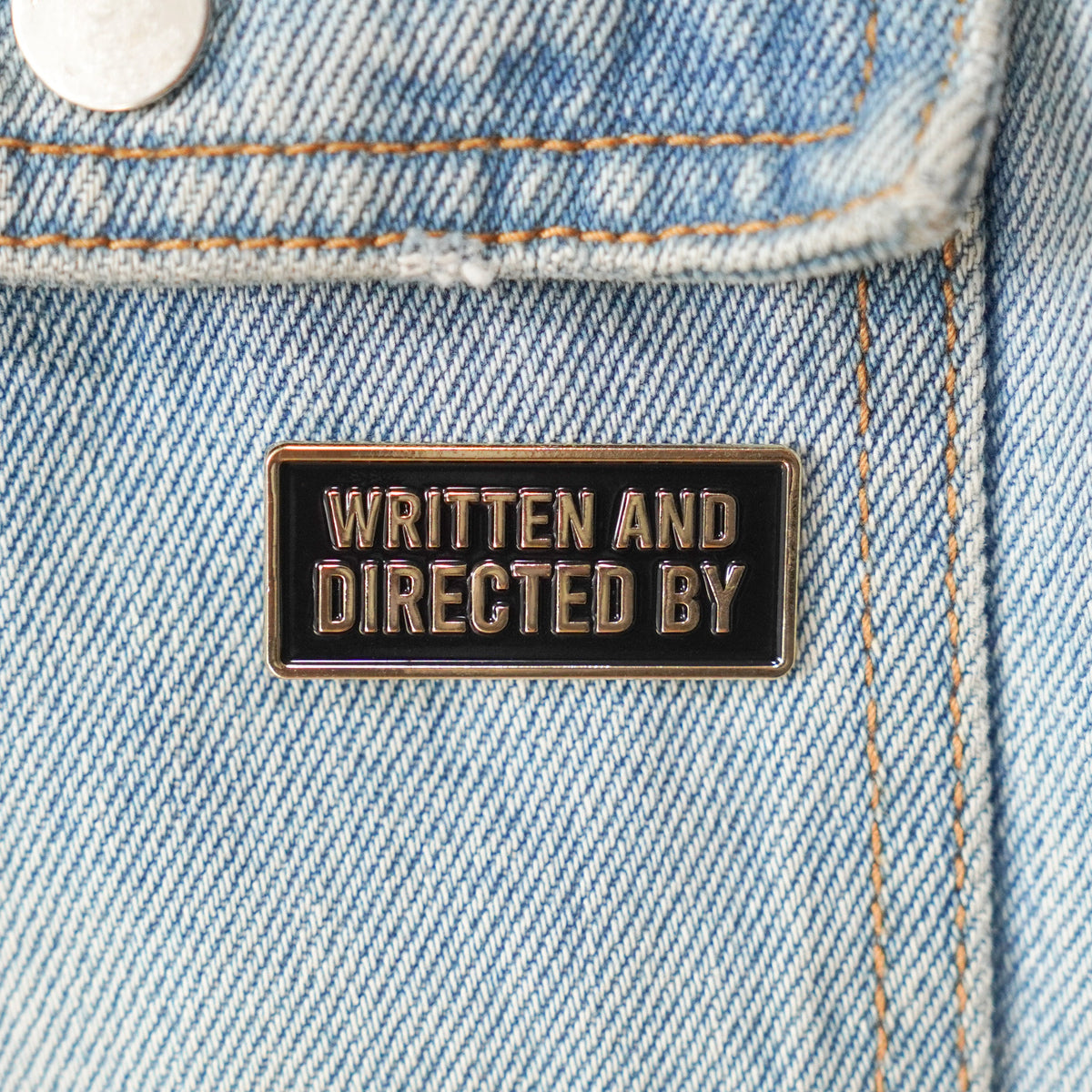 Written and Directed By Credit Enamel Pin on a jacket