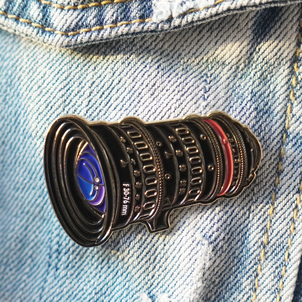 Cine Zoom Lens Enamel Pin on a jacket